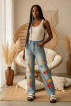 Unisex Denim Jeans Featuring a Color Splat Graphic Print, Sun-Faded Finish, and Raw Hemline