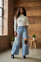 Distressed Wide-Leg Women’s Vintage-Wash Jeans Featuring Afro Queen Graphic Print ODMPOD