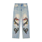 Denim Jeans Featuring a Raw Hem and Colorful Dragon Art with a Faded Sun Effect ODMPOD