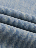 Unisex Denim Jeans Featuring a Color Splat Graphic Print, Sun-Faded Finish, and Raw Hemline