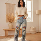 Denim Jeans Featuring a Raw Hem and Colorful Dragon Art with a Faded Sun Effect ODMPOD